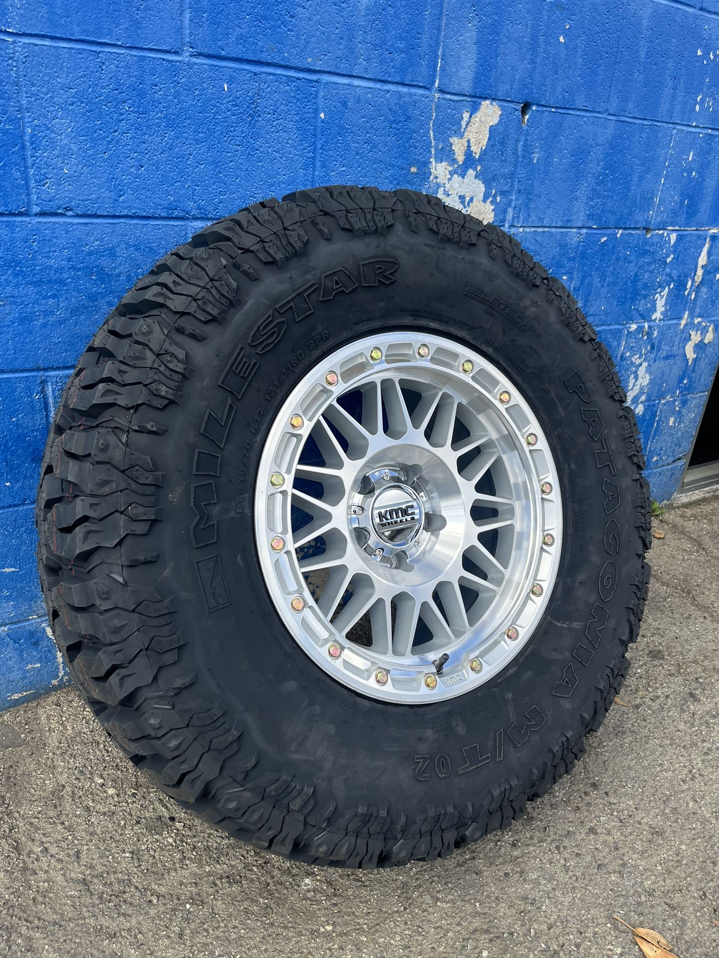 KMC KM555 Attack Wheels 17”5x5/Milestar Patagonia M/TO2 315-70-17 Machined